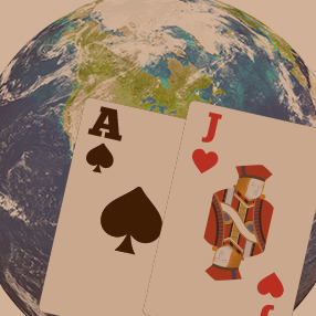 blackjack hand and a world globe
